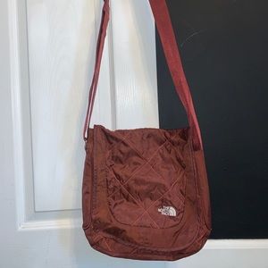 North face shoulder bag with adjustable straps.